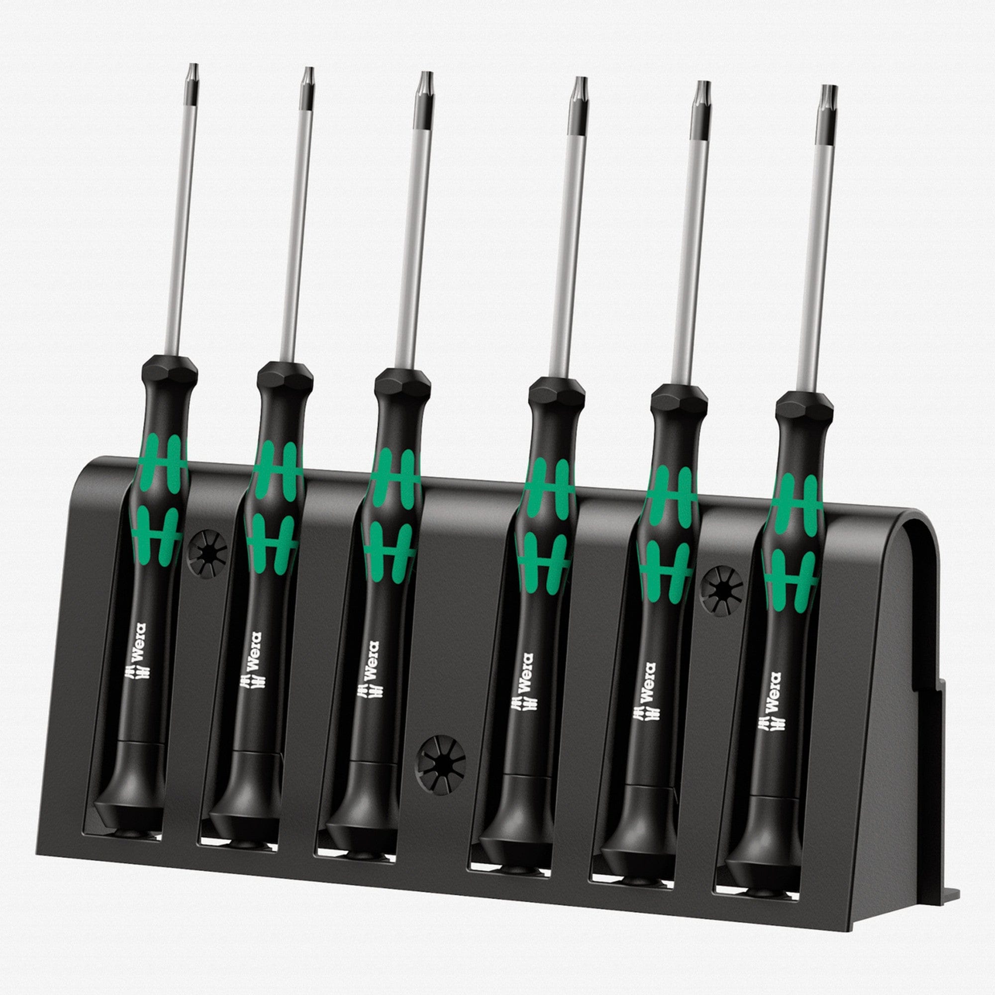 Image of Wera Kraftform Micro Security Torx Precision Screwdriver Set & Rack
The image features a Wera Micro Screwdriver Set. Six screwdrivers with silver shafts and black handles with green ergonomic grips are neatly placed in a black holder. Each handle has a small symbol indicating the screwdriver type. The holder has slots to keep the tools upright and displays the Wera logo. The neutral background emphasizes the organized and high-quality presentation of the micro screwdriver set.

