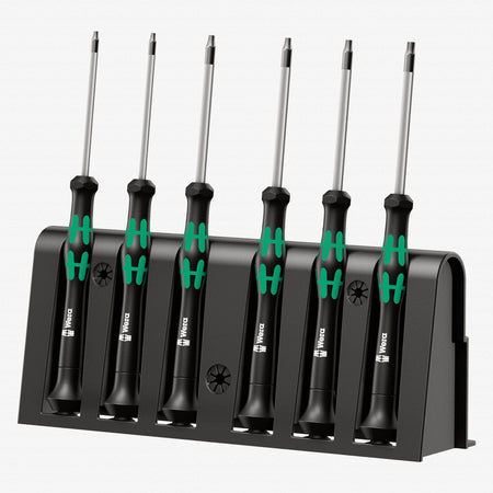 Image of Wera Kraftform Micro Security Torx Precision Screwdriver Set & Rack
The image features a Wera Micro Screwdriver Set. Six screwdrivers with silver shafts and black handles with green ergonomic grips are neatly placed in a black holder. Each handle has a small symbol indicating the screwdriver type. The holder has slots to keep the tools upright and displays the Wera logo. The neutral background emphasizes the organized and high-quality presentation of the micro screwdriver set.

