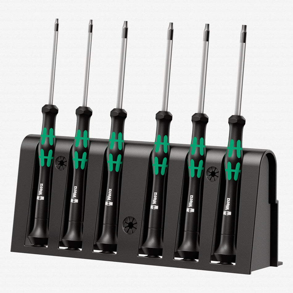 Image of Wera Kraftform Micro Security Torx Precision Screwdriver Set & Rack
The image features a Wera Micro Screwdriver Set. Six screwdrivers with silver shafts and black handles with green ergonomic grips are neatly placed in a black holder. Each handle has a small symbol indicating the screwdriver type. The holder has slots to keep the tools upright and displays the Wera logo. The neutral background emphasizes the organized and high-quality presentation of the micro screwdriver set.


