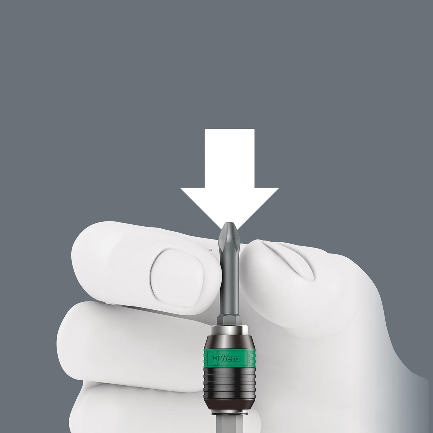 Close-up demonstration of a user inserting a Phillips head bit into the Wera Rapidaptor quick-release chuck, highlighting the easy one-handed bit change process.