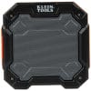 The image shows a portable speaker. It's mostly orange and black, with a grid-like speaker cover on the front. You can see the brand name "Klein Tools" on the speaker.
