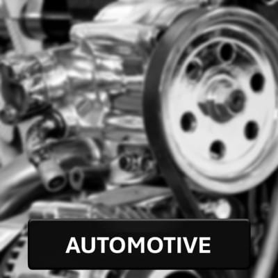 automotive button on a blurry engine background.