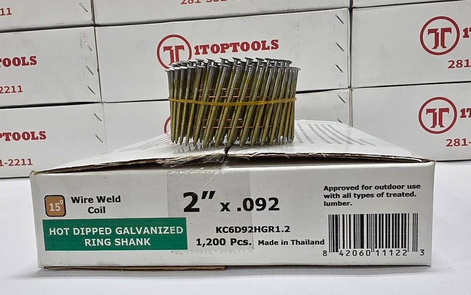 A box of KCGD92GHRL2 hot dipped galvanized ring shank wire weld coil nails, with a spool of the nails displayed on top of the box, set against a background of stacked Top Tools boxes.
