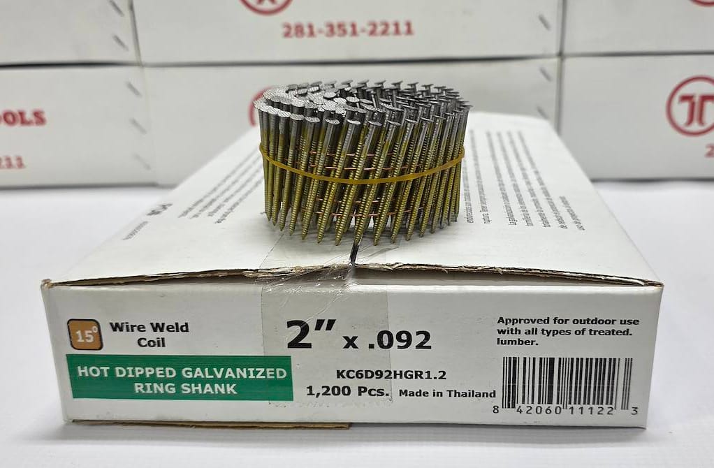 A coil of wire weld ring shank nails on top of its white retail box, with several identical boxes stacked in the background. The box is labeled '2" x .