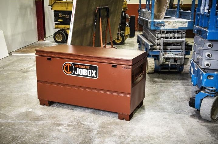 A Crescent JOBOX on a the floor of a wharehouse.