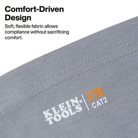 Close-up of a gray fabric product with visible stitching and the Klein Tools FR CAT2 logo printed on it, alongside marketing text about comfort-driven design on a white background.