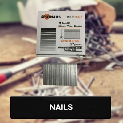 Box of Spotnails nails with a blurred background of tools