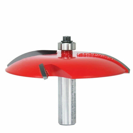 This is a close-up image of a red and silver woodworking router bit. It has a rounded, mushroom-shaped cutting head with two black cutting blades and a small bearing on top.