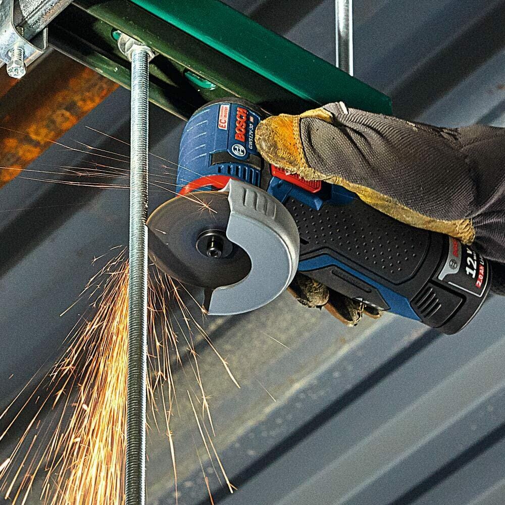 BOSCH DB343C 3 in. continuous rim diamond blade cutting metal with sparks, 3/8 in. arbor for clean wet cuts.