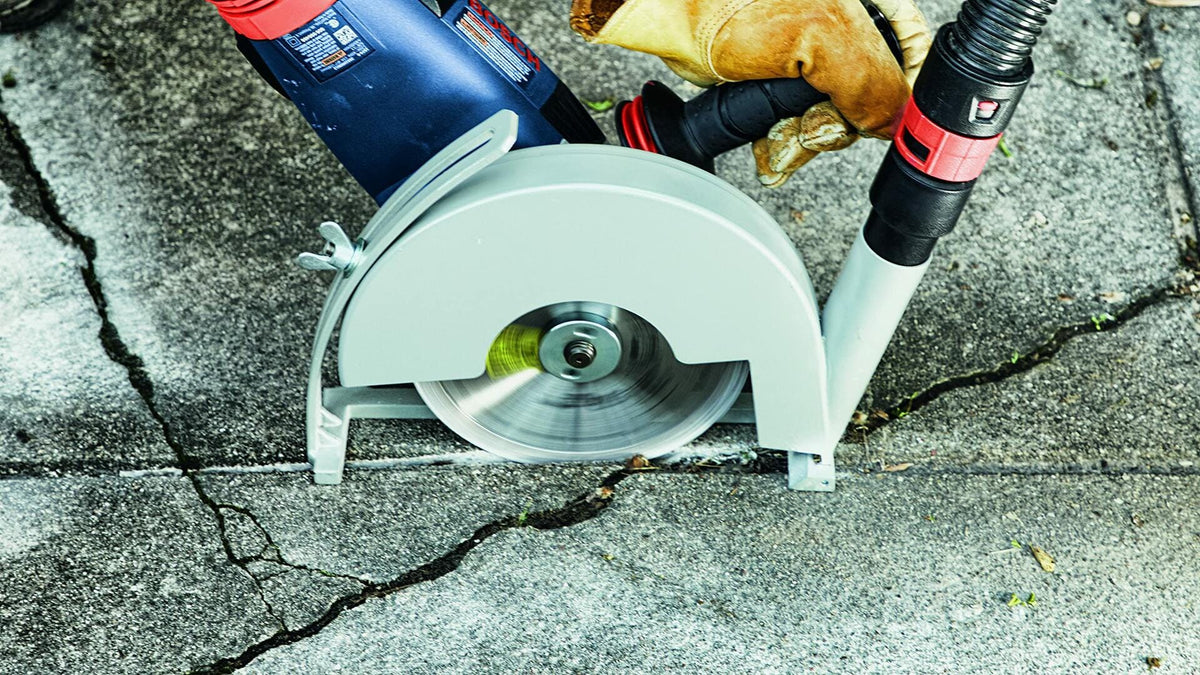 BOSCH DB741SD 7 in. Standard Segmented Rim Diamond Blade cutting concrete block in wet/dry applications.