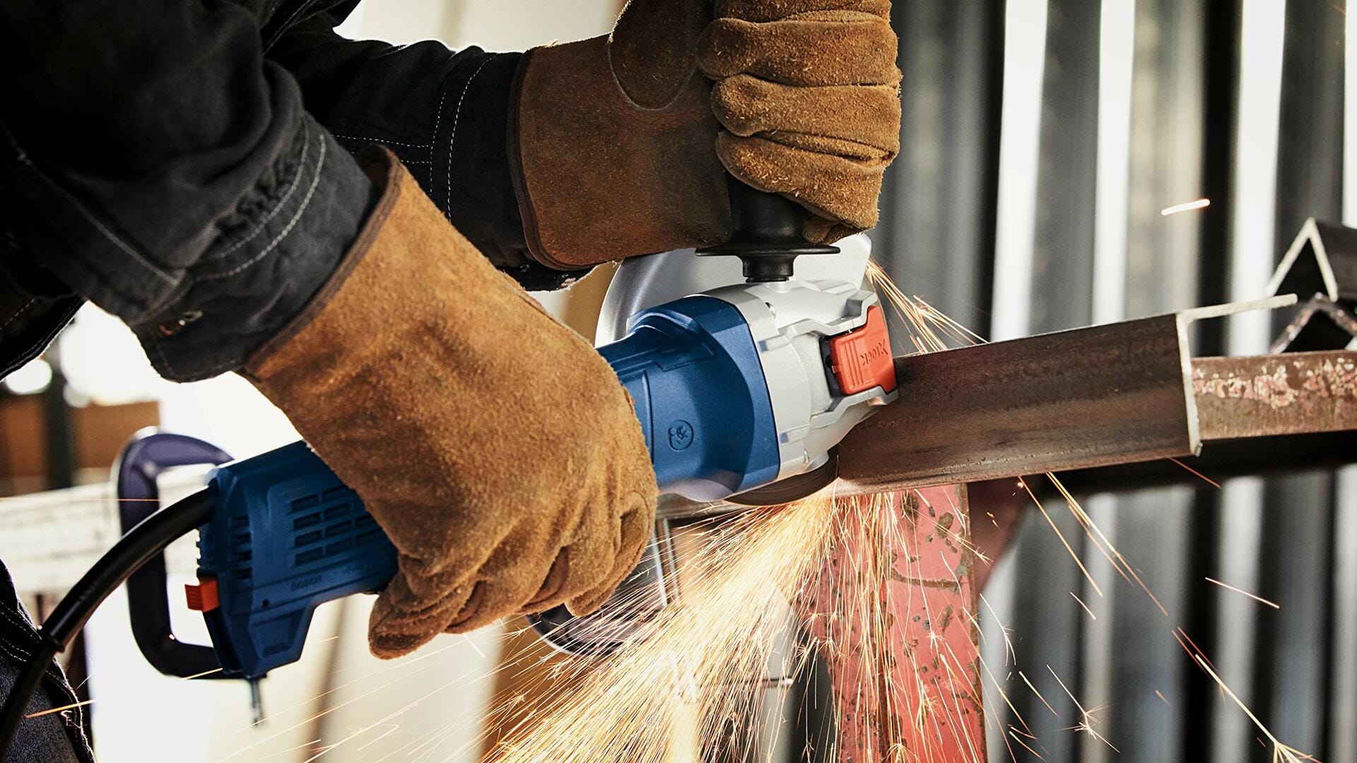 BOSCH DBX641S 6 In. X-LOCK Segmented Rim Diamond Blade cutting metal with sparks flying from grinder.