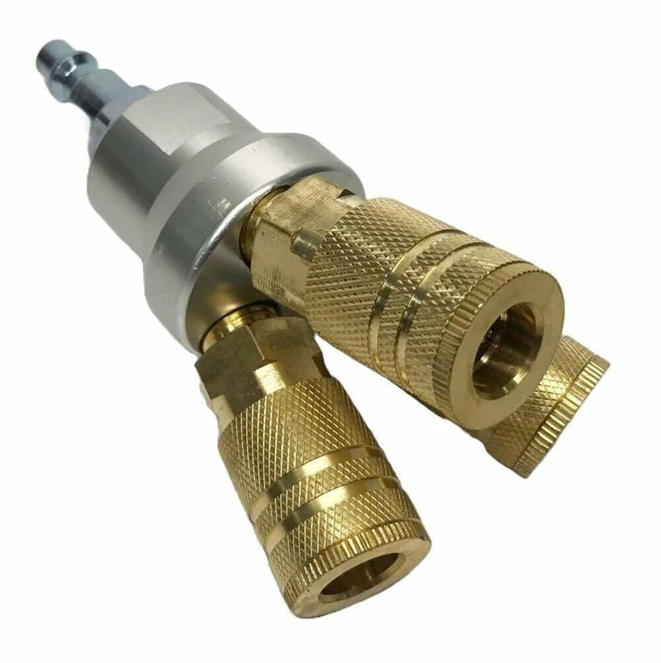 Brass and silver pressure washer nozzle on a white background