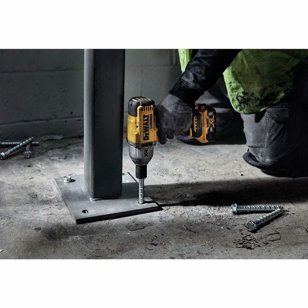 DeWalt 20V MAX XR 1/2 in. High Torque Cordless Impact Wrench with Hog Ring Anvil Brushless Motor in use on metal base plate