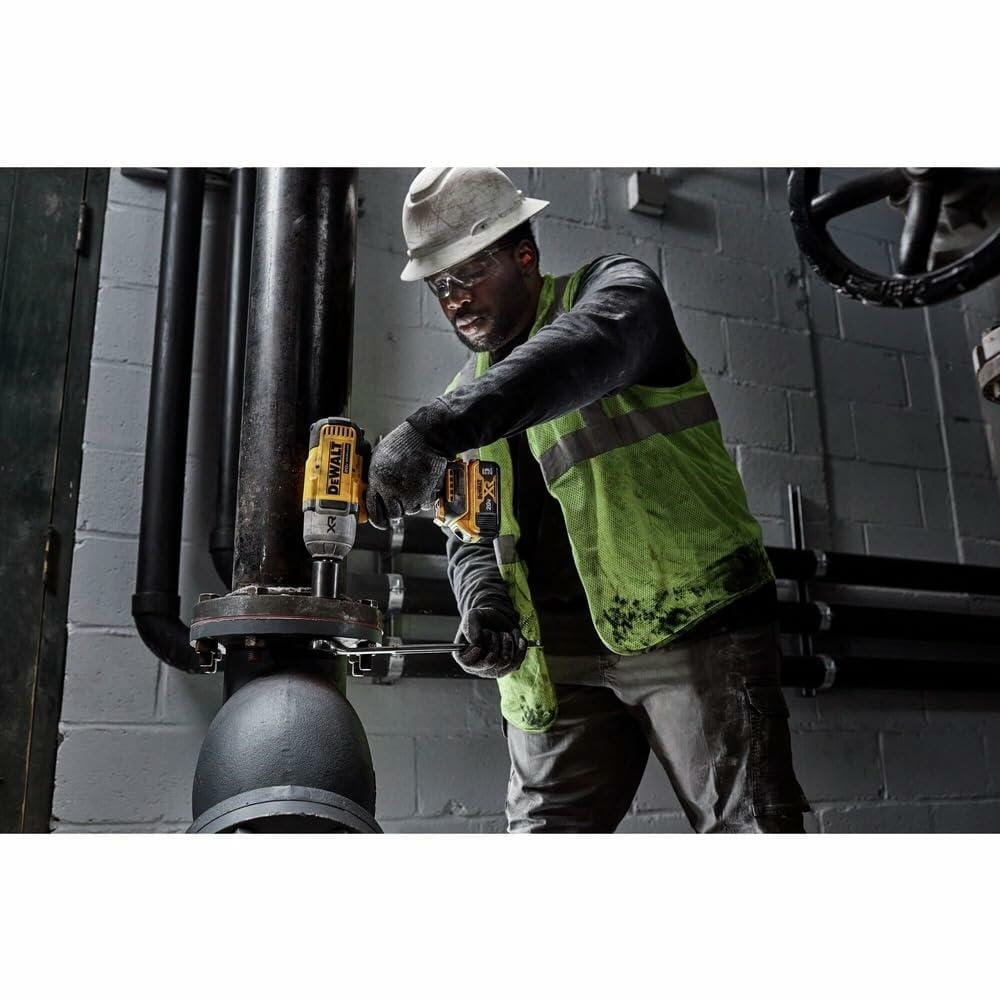 DeWalt 20V MAX XR 1/2 in. High Torque Cordless Impact Wrench with Hog Ring Anvil in use on industrial piping