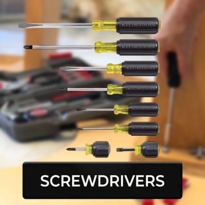 Set of screwdrivers with a tool case in the background