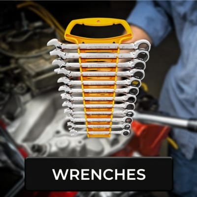 Wrenches button with a blurry mechanic working on a car as a background
