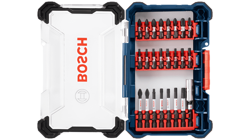 BOSCH 24 pc. Impact Tough Screwdriving Custom Case System Set. 
This is an open blue and clear plastic case, revealing a comprehensive set of black and silver screwdriver bits neatly organized in red holders. The clear lid has the "BOSCH" logo printed in red vertically on its left side.
