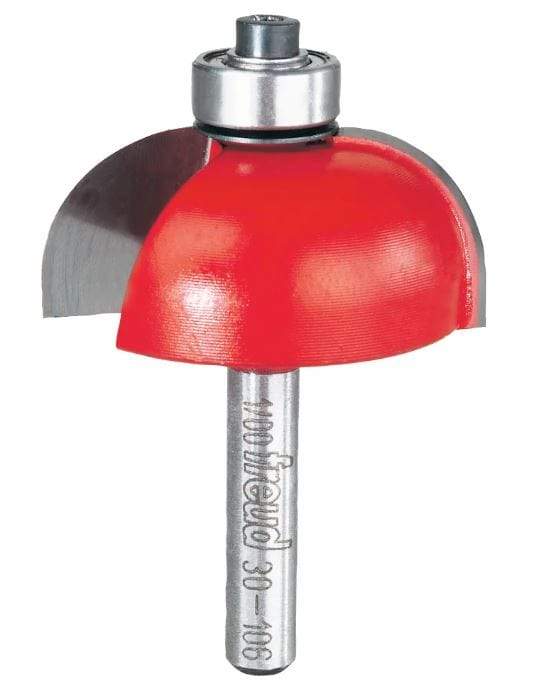 Image of Freud 1/2" Radius Cove Bit. 
This close-up image shows a woodworking router bit, featuring a bright red, bell-shaped cutting head with exposed silver blades on either side. At the very top, there's a small silver bearing, and below the red head, a silver shaft is visible with "100 Freud 30-106" engraved along its side.